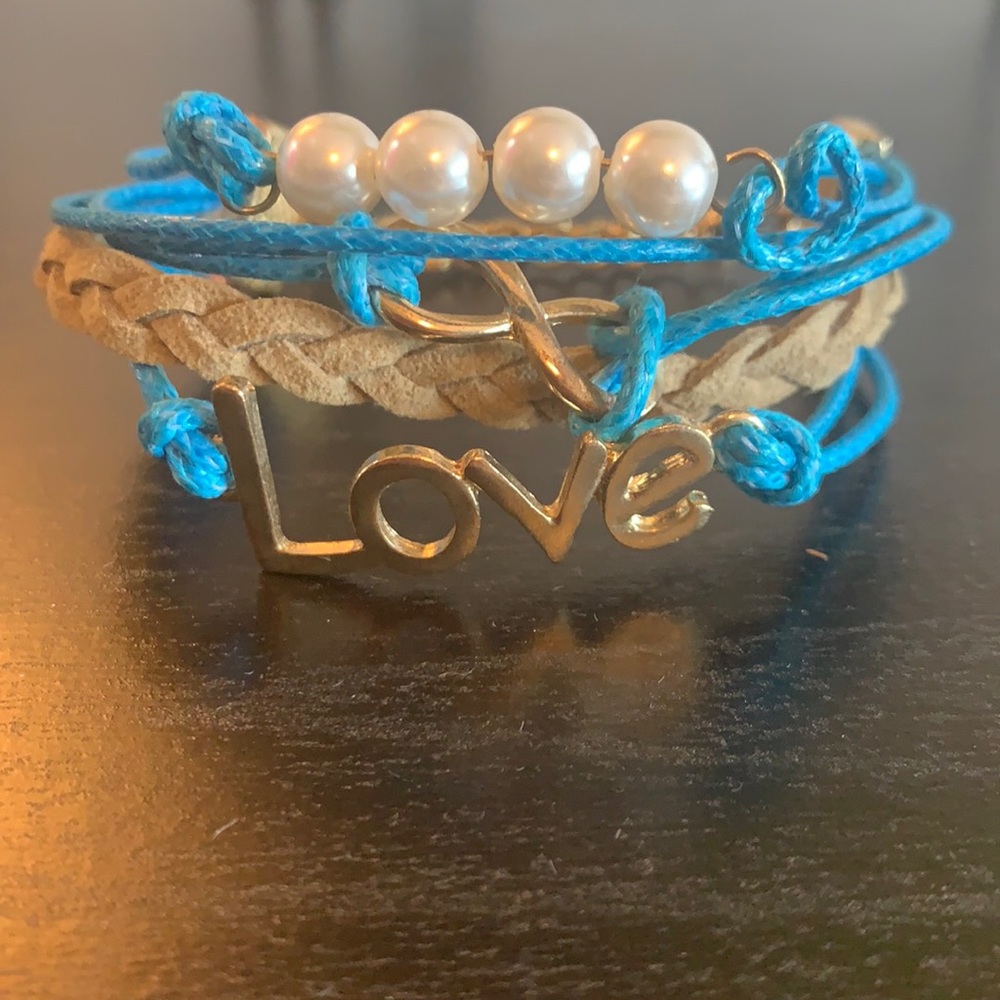 Love, blue gold and pearl bracelets